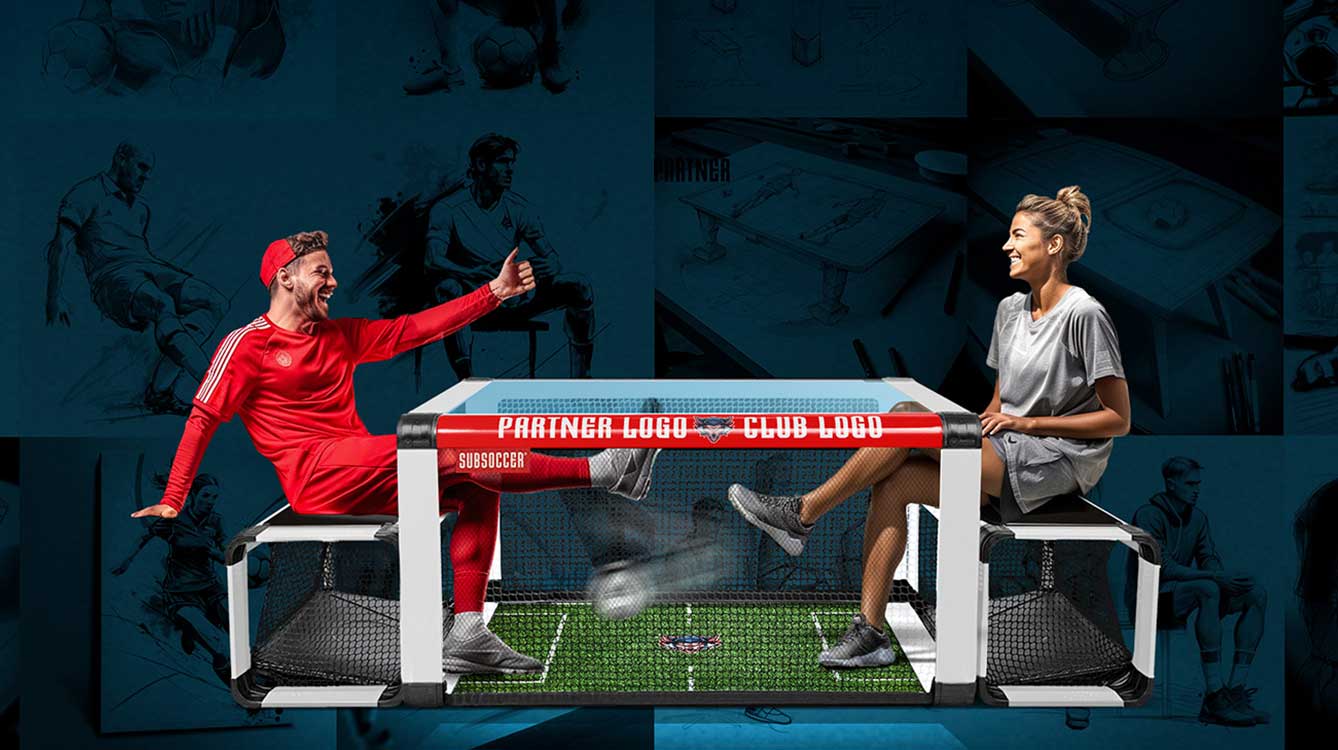 Two people playing soccer sitting on benches under a table